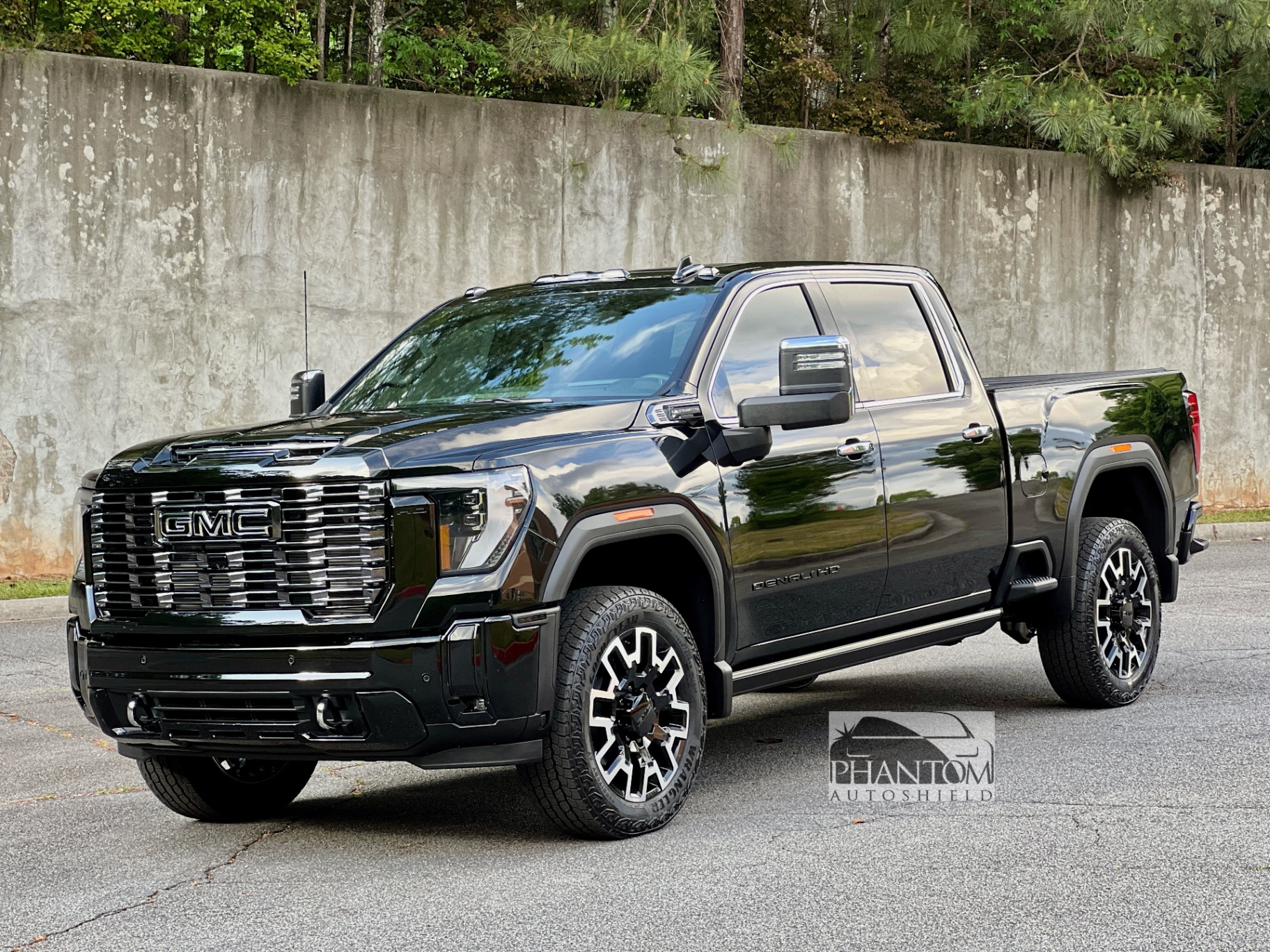 Black 2026 GMC Denali Ultimate detailed by Phantom Auto Shield with glossy paint protection finish.