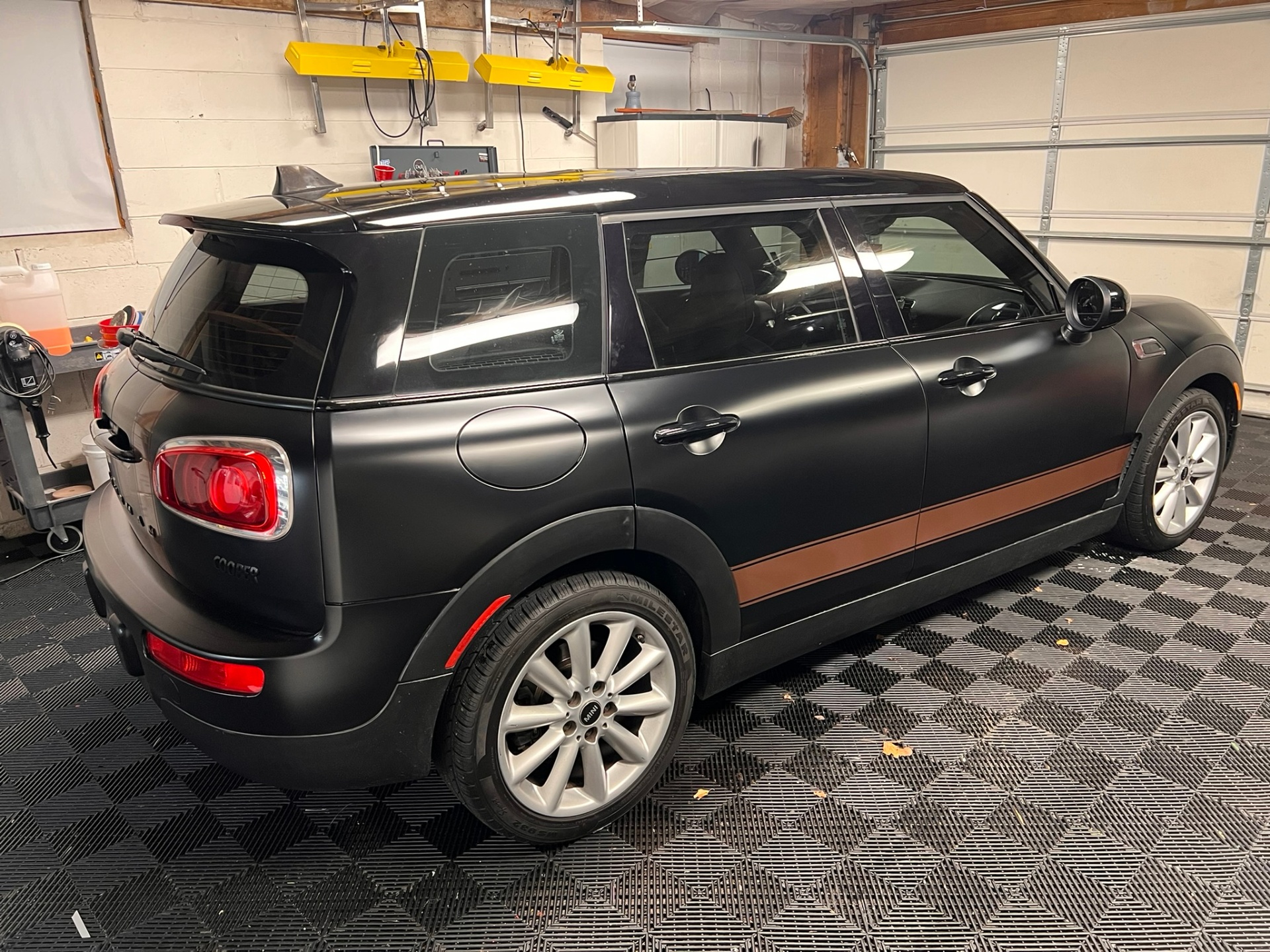 Black matte MINI Clubman photographed inside the shop after detailing.